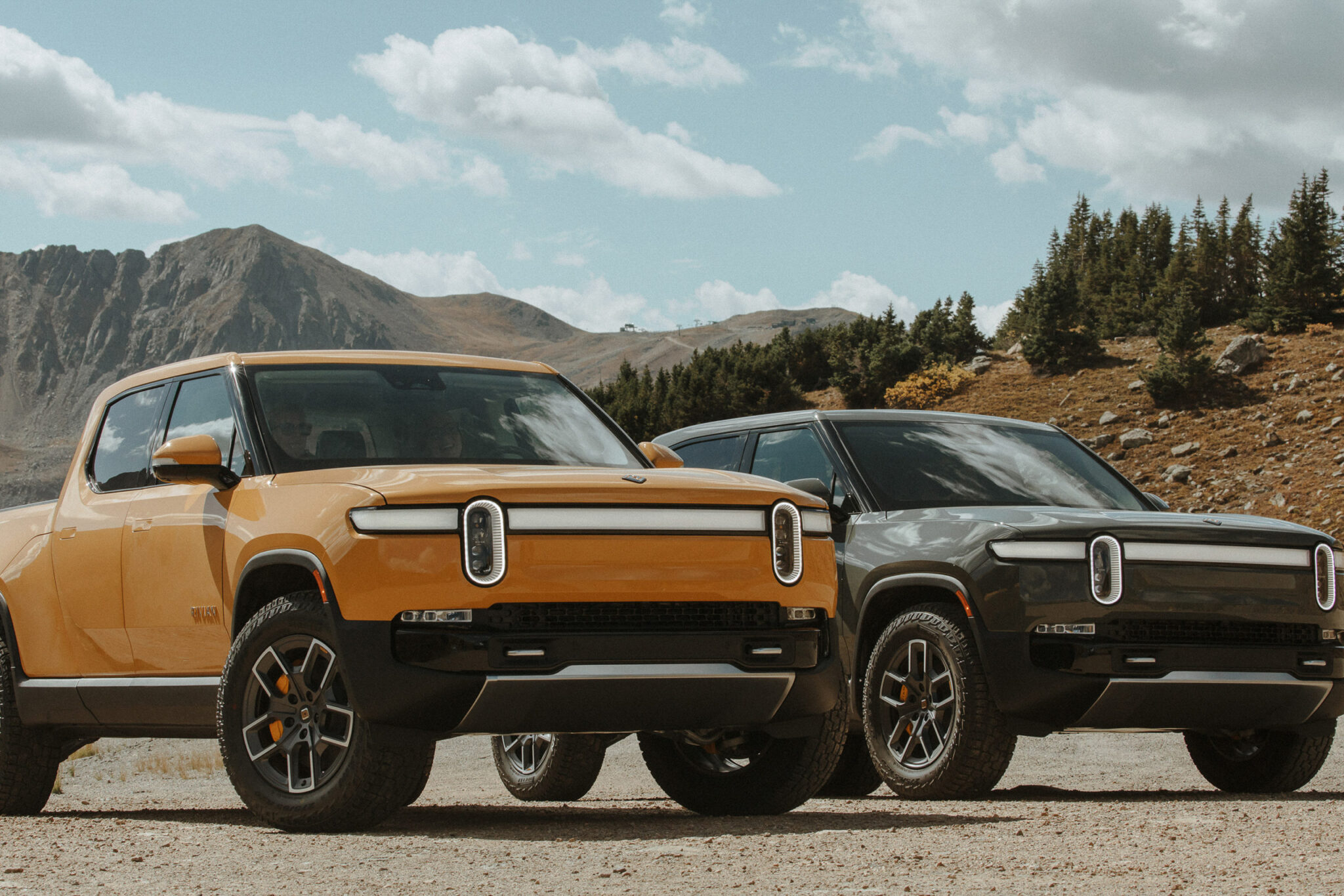 two rivian r1t electric vehicles